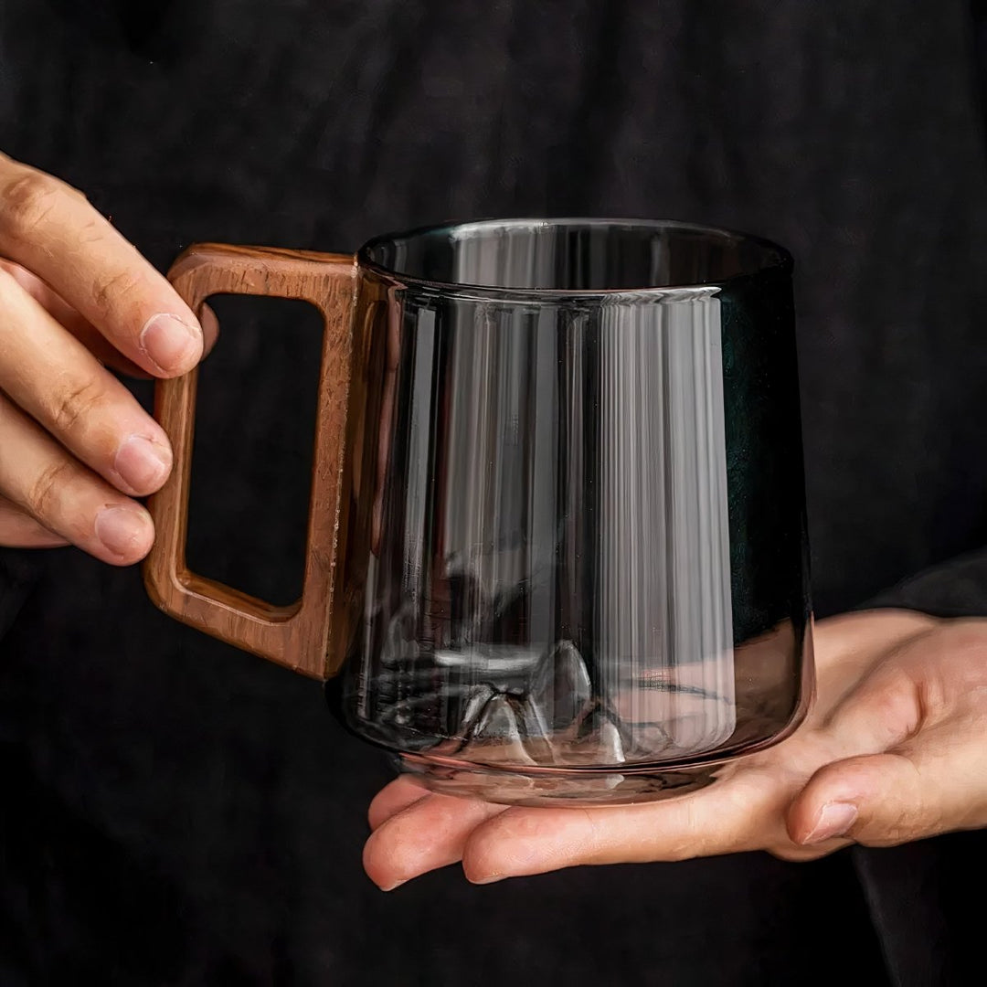Elegant slanted coffee cups made of smoky glass with walnut wood handle